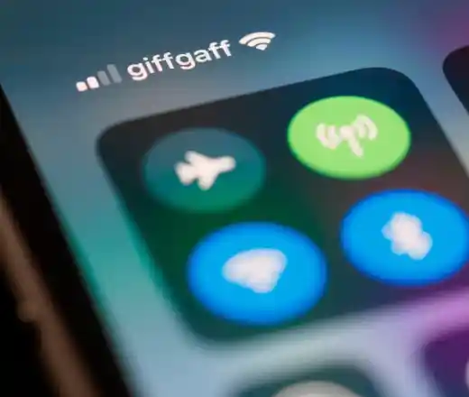 Close-up of a smartphone screen showing the control center with WiFi, Bluetooth, and airplane mode icons, and 'giffgaff' displayed as the mobile network provider with a WiFi connection icon.
