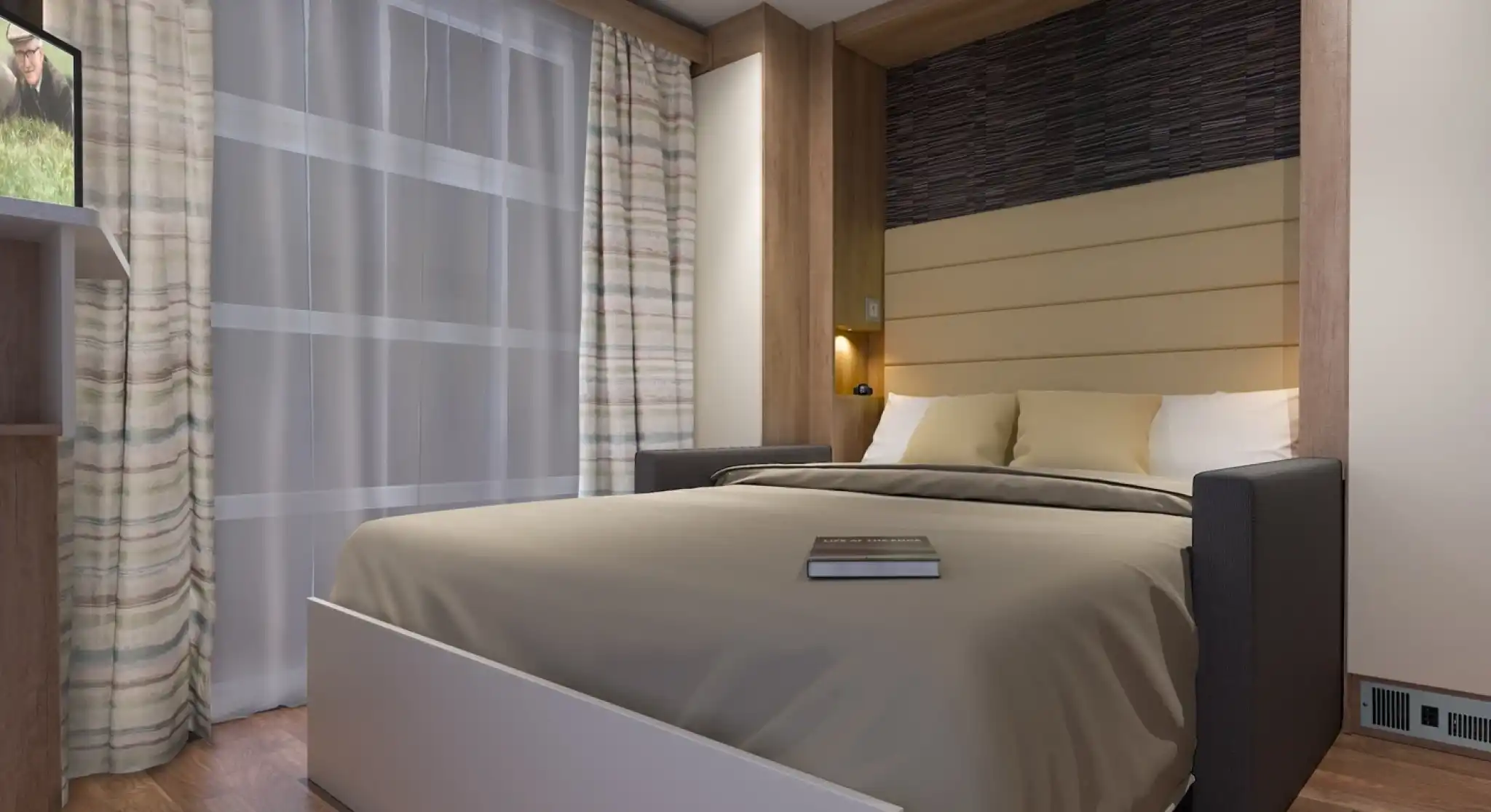 A cozy bedroom featuring a platform bed with a gray and beige color scheme. The backdrop has wood paneling and soft lighting. A small bookshelf is visible with a book resting on the bed. Sheer curtains let in natural light, and the flooring is made of warm-toned wood.
