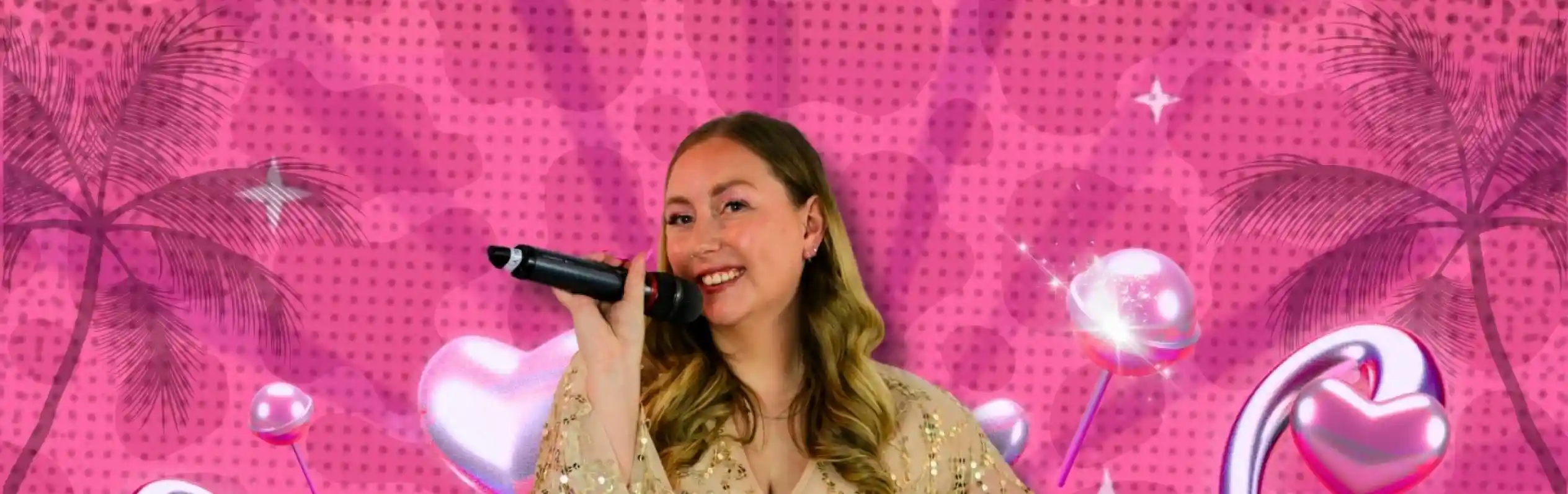A woman with long, wavy hair holds a microphone and smiles, wearing a sparkling, light-colored outfit. The background features a bright pink pattern with hearts and palm trees. The name "Emily Pitcher" is prominently displayed in bold, white letters.