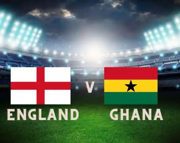 England and Ghana flags displayed prominently with the words "England v Ghana" against a backdrop of a stadium filled with bright lights.