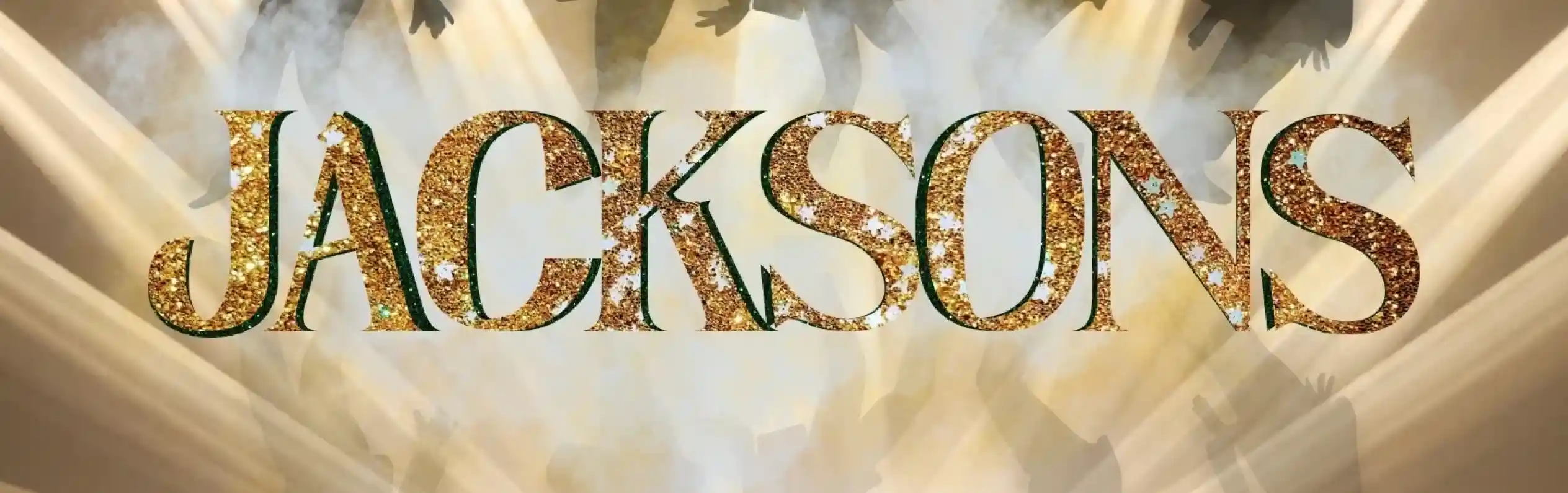 The word "JACKSONS" is displayed in glittering gold letters against a backdrop of silhouetted dancers and dramatic spotlight beams. Smoke effects enhance the stage atmosphere.