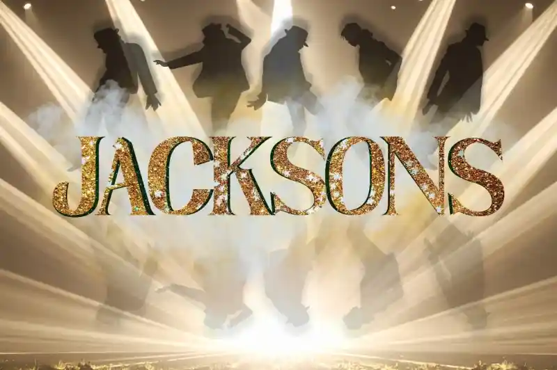 The word "JACKSONS" is displayed in glittering gold letters against a backdrop of silhouetted dancers and dramatic spotlight beams. Smoke effects enhance the stage atmosphere.