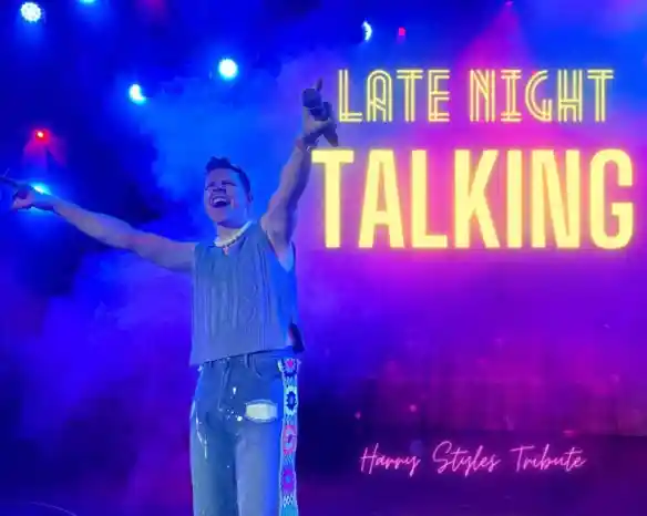 A performer with a joyful expression stands on stage, holding a microphone and wearing a sleeveless sweater and embellished jeans. Colorful lights and smoke create a vibrant atmosphere, with "Late Night Talking" prominently displayed in bold text.