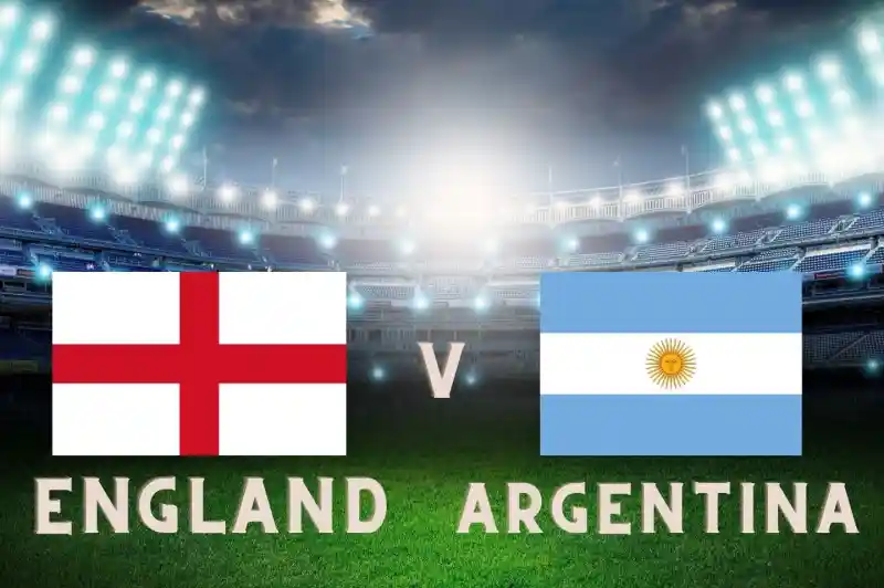 English and Argentinian flags displayed with "England v Argentina" text on a grassy soccer field under stadium lights.