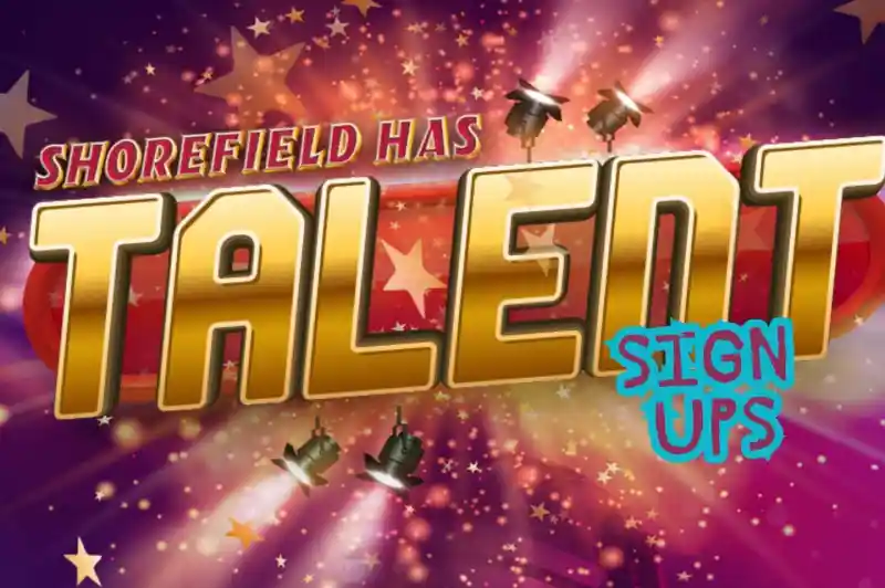 A colorful poster for "Shorefield Has Talent," featuring bold gold lettering with spotlight graphics and the text "Sign Ups" in bright blue. The background includes stars and a microphone, conveying a vibrant talent show theme.