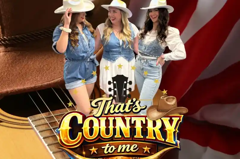 Three women dressed in matching denim outfits and cowboy hats pose playfully against a backdrop of a guitar and an American flag. The text "That's Country to Me" is prominently displayed at the bottom.
