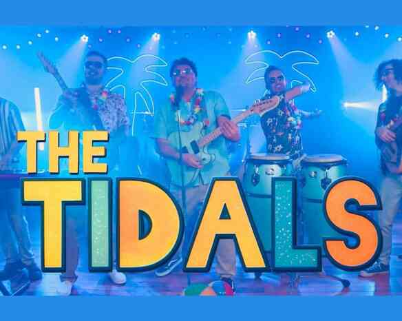 A lively band named "The Tidals" performs on stage, wearing tropical shirts and leis. They are playing various instruments, including a guitar and congas, with a vibrant blue background featuring palm trees and colorful lights.