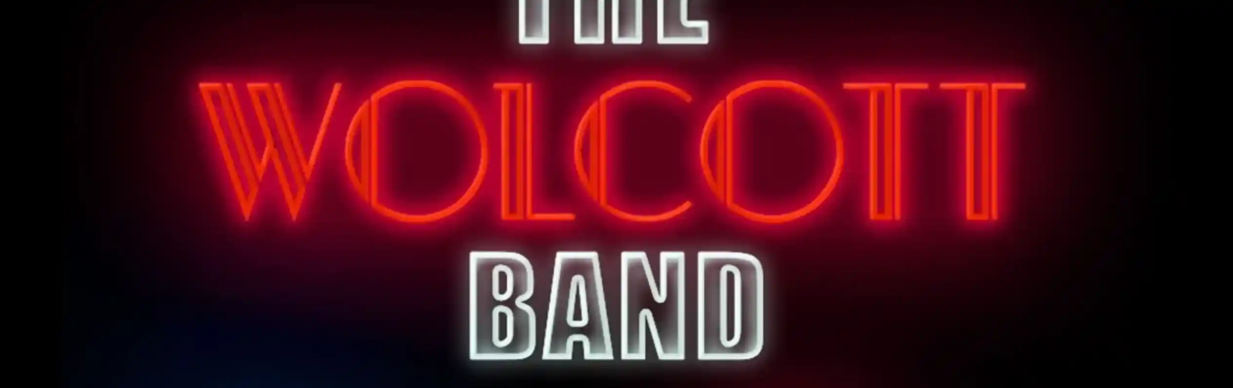 Neon-style text displays "The Wolcott Band" with social media icons for Facebook, Instagram, YouTube, and TikTok below it on a black background.