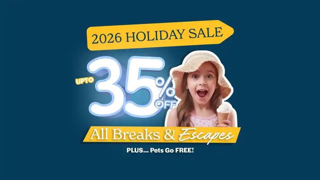 A young girl in a straw hat excitedly holds an ice cream cone, with promotional text highlighting a holiday sale offering up to 35% off on breaks and escapes, and mentioning that pets go free.