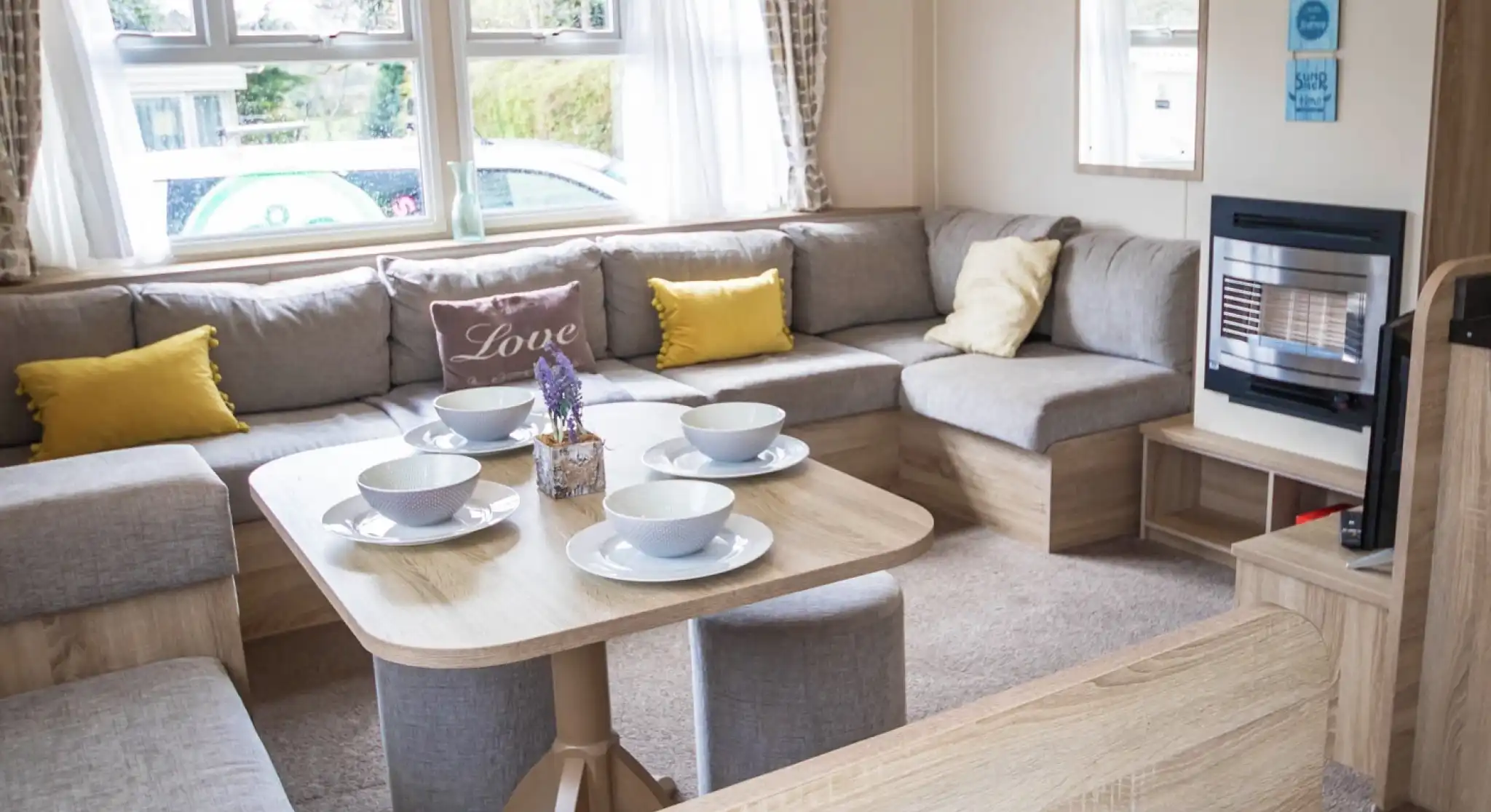 A stylish living room showcasing a couch, a table, and chairs, creating an inviting atmosphere for gatherings.