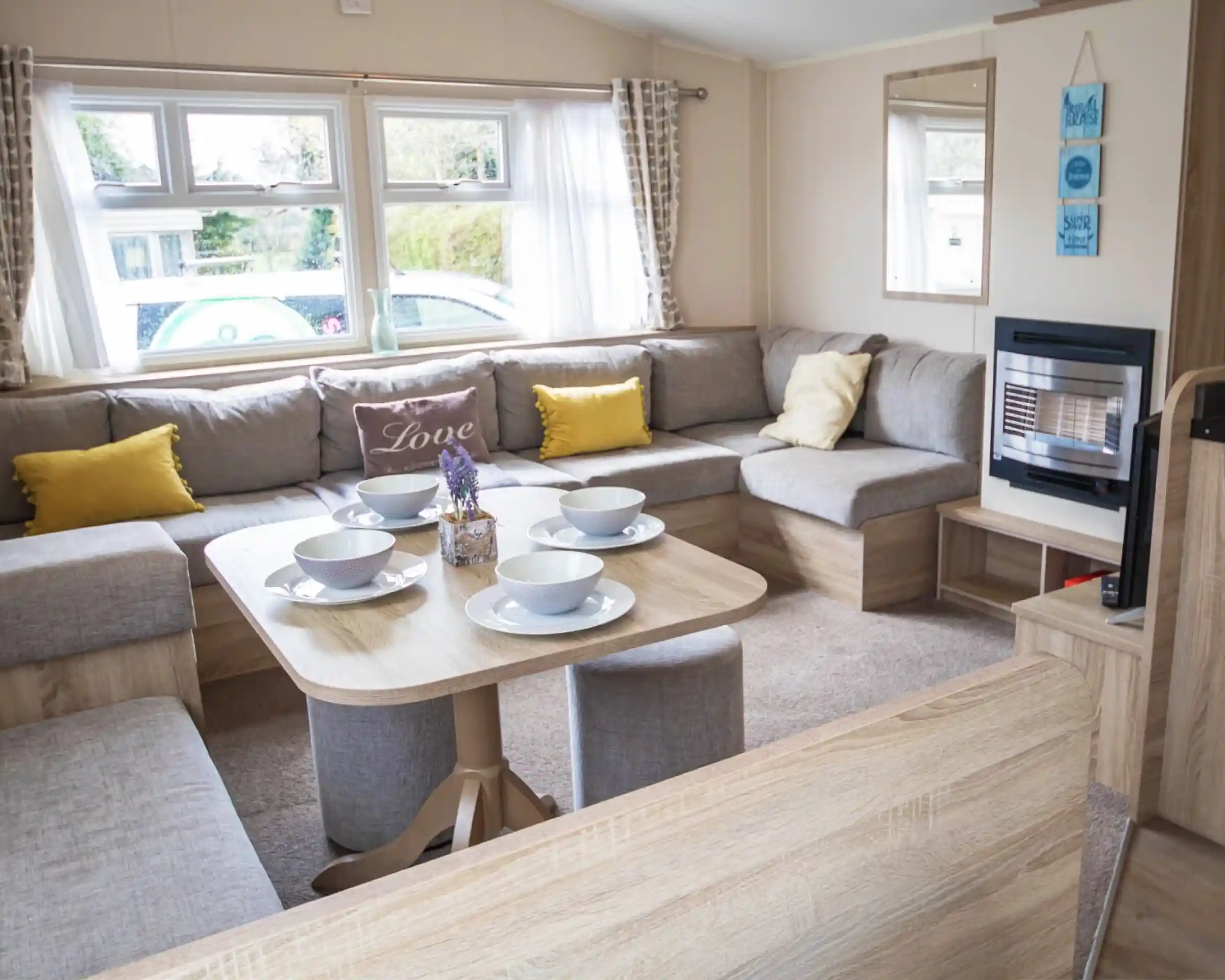 A stylish living room showcasing a couch, a table, and chairs, creating an inviting atmosphere for gatherings.