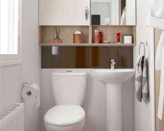 Light and airy bathroom with WC and wash hand basin, together with storage above