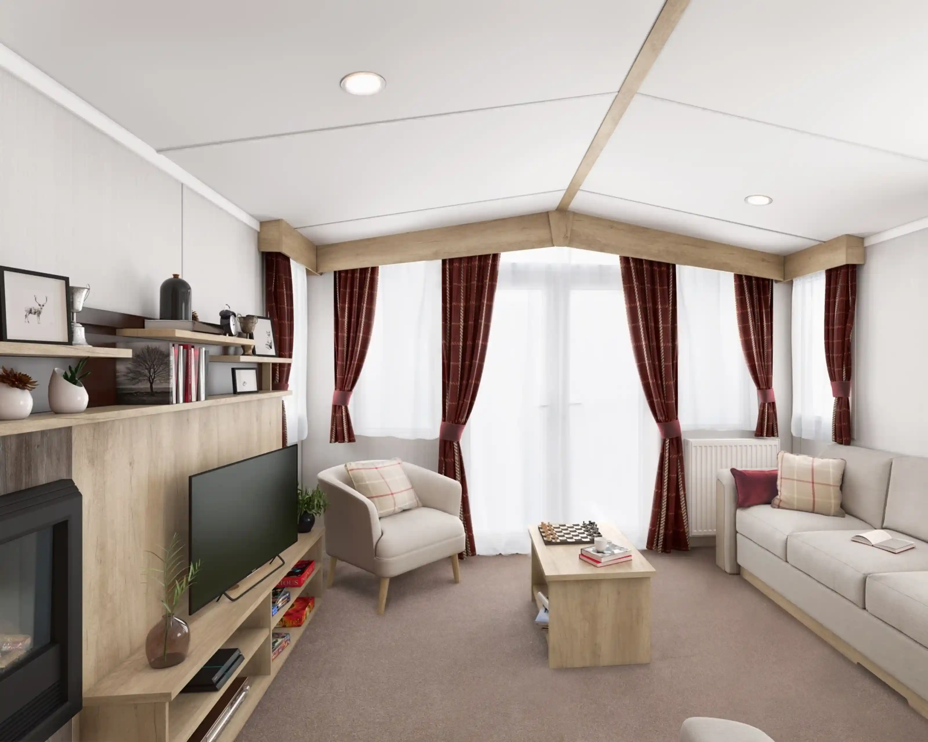 Bright lounge with light colours sofa and tub chair, with a coffee table, TV and fireplace