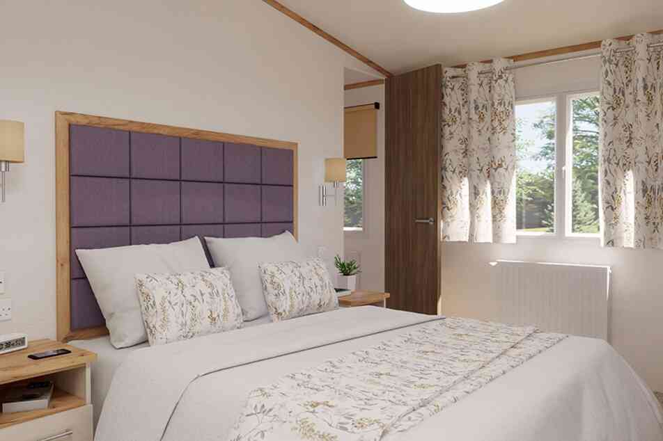 A stylish bedroom featuring a double bed, two bedside tables and a window, creating a warm and inviting atmosphere.