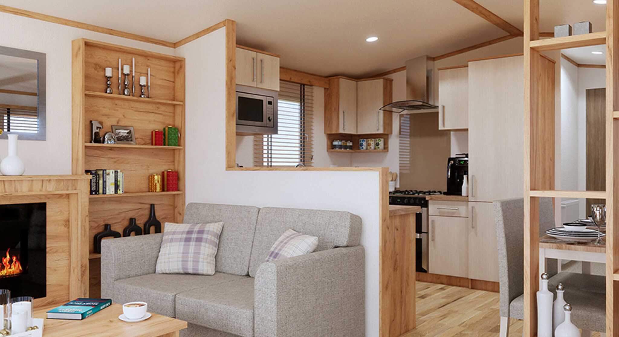 A stylish open plan living room with a comfortable sofa, a coffee table, and a fireplace, perfect for relaxation and gatherings.