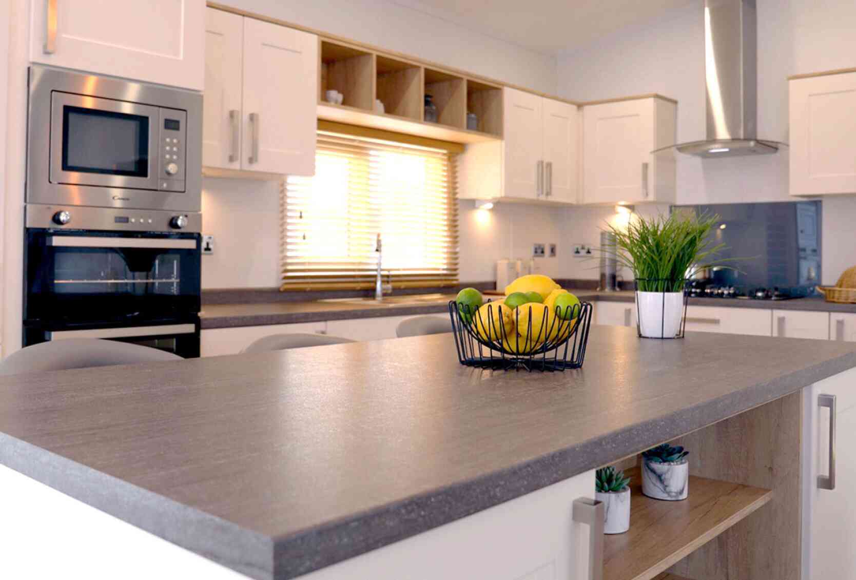 A well-designed kitchen displaying a counter top and sink, highlighting an efficient and practical cooking area.