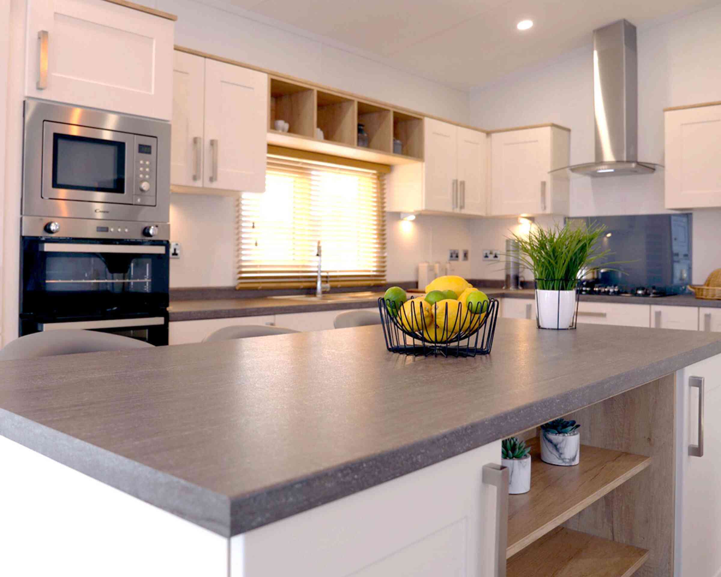 A well-designed kitchen displaying a counter top and sink, highlighting an efficient and practical cooking area.