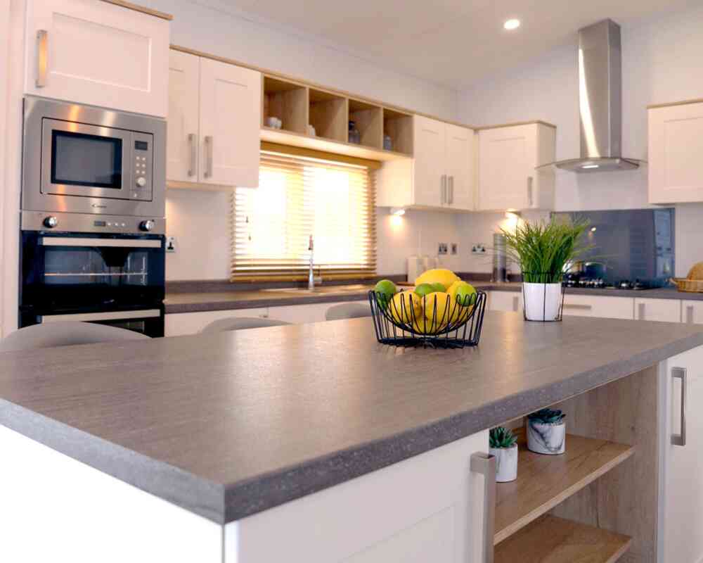 A well-designed kitchen displaying a counter top and sink, highlighting an efficient and practical cooking area.