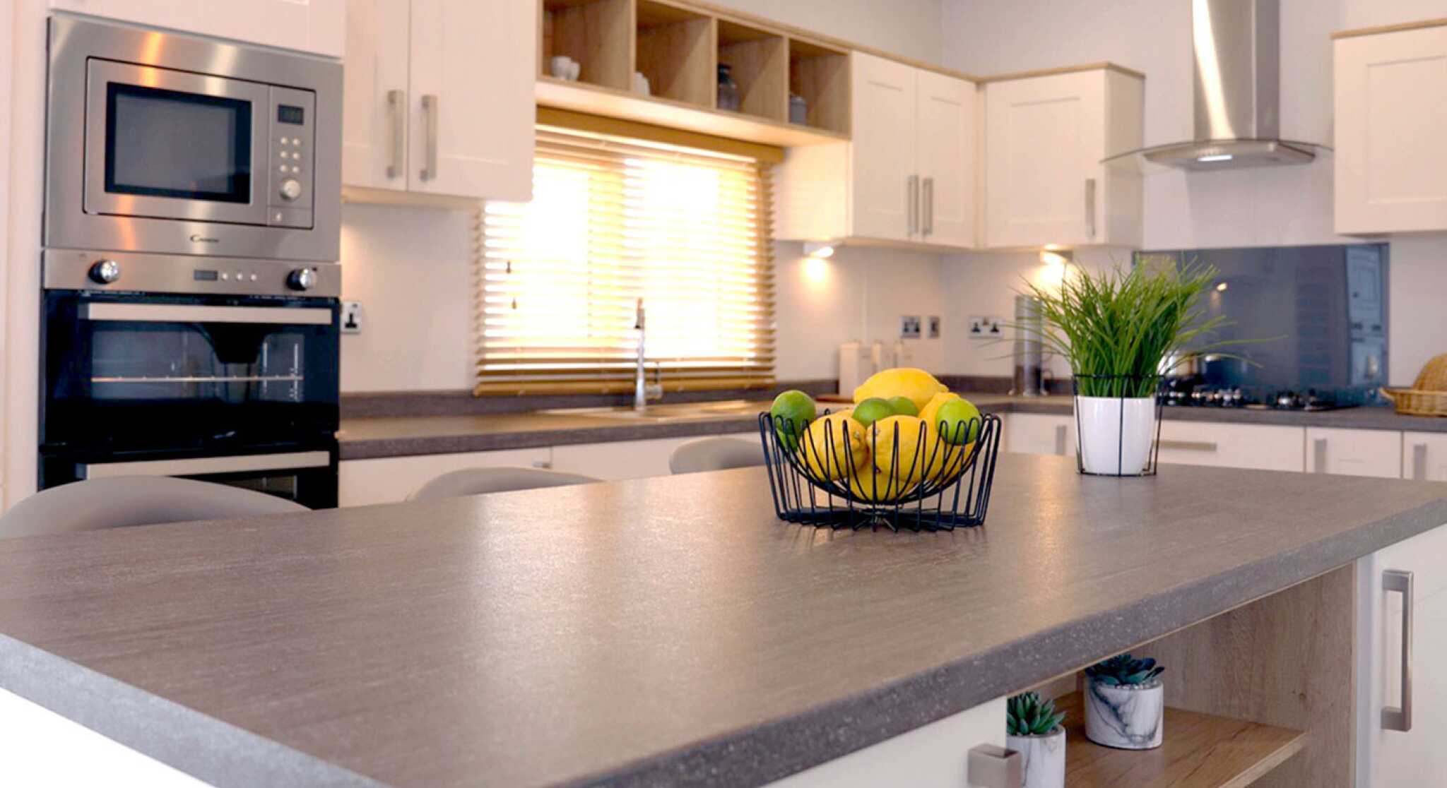 A well-designed kitchen displaying a counter top and sink, highlighting an efficient and practical cooking area.