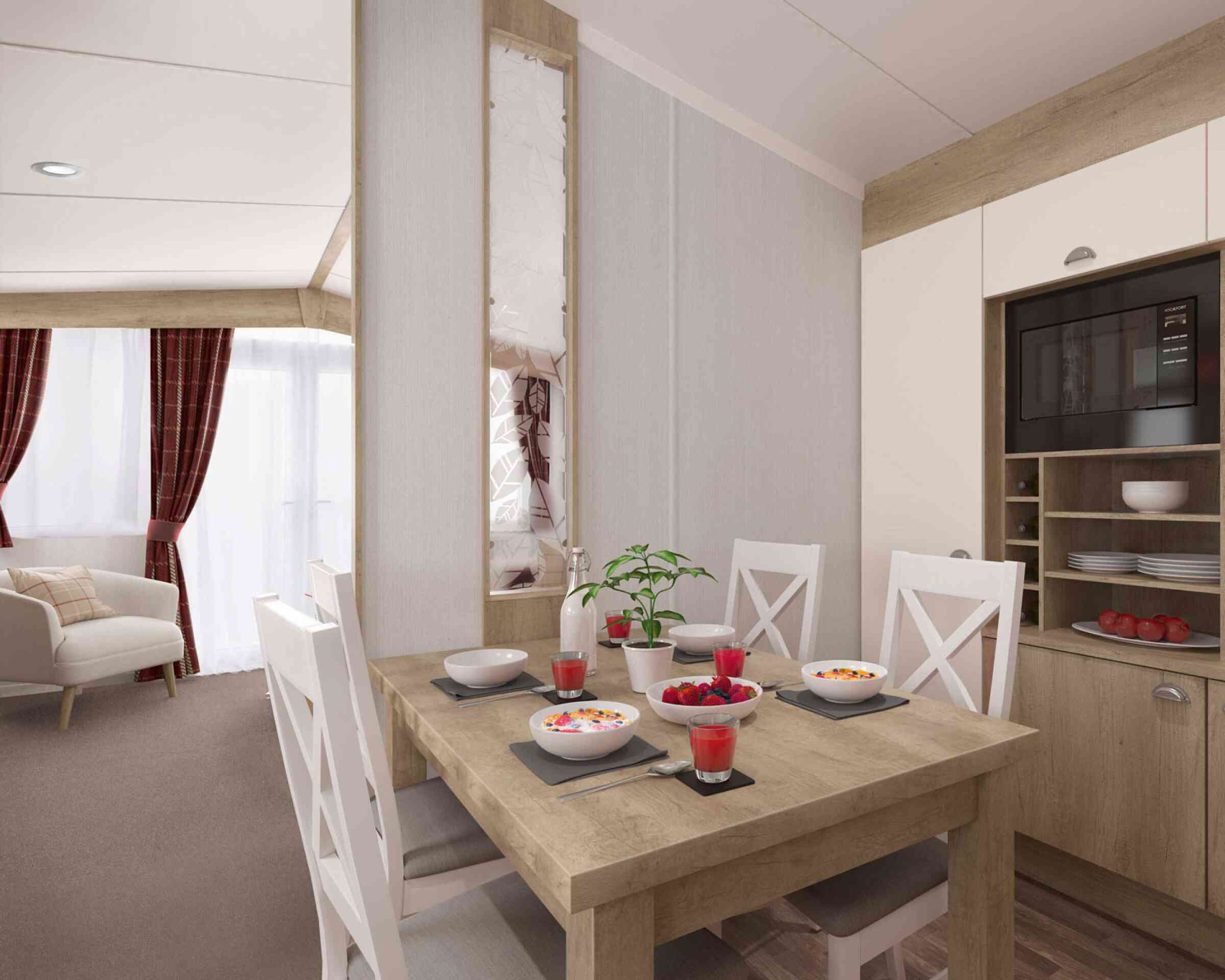 Contemporary dining area set for four with food and juice, adjacent to a comfortable living room with sofa and curtains.