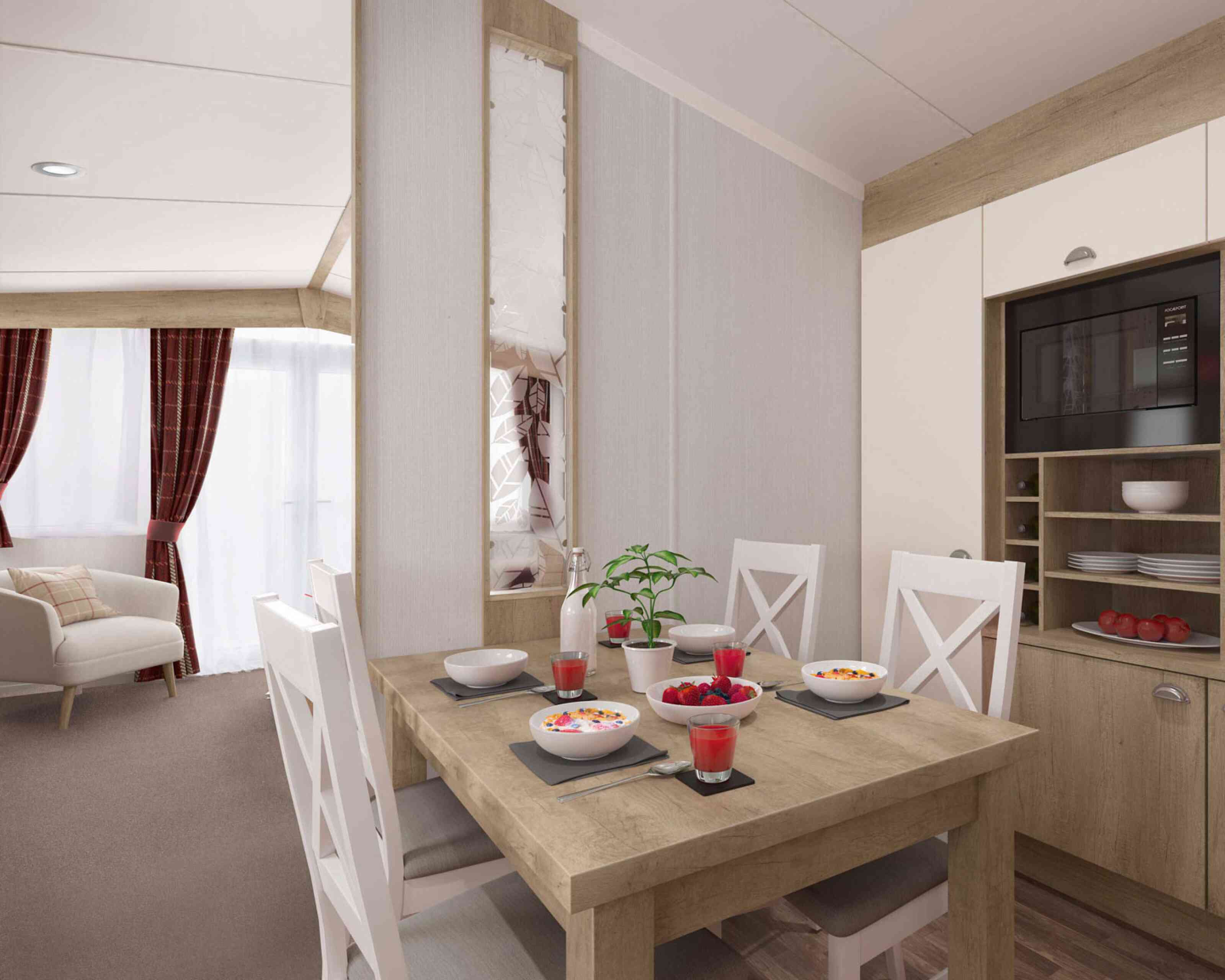 Contemporary dining area set for four with food and juice, adjacent to a comfortable living room with sofa and curtains.