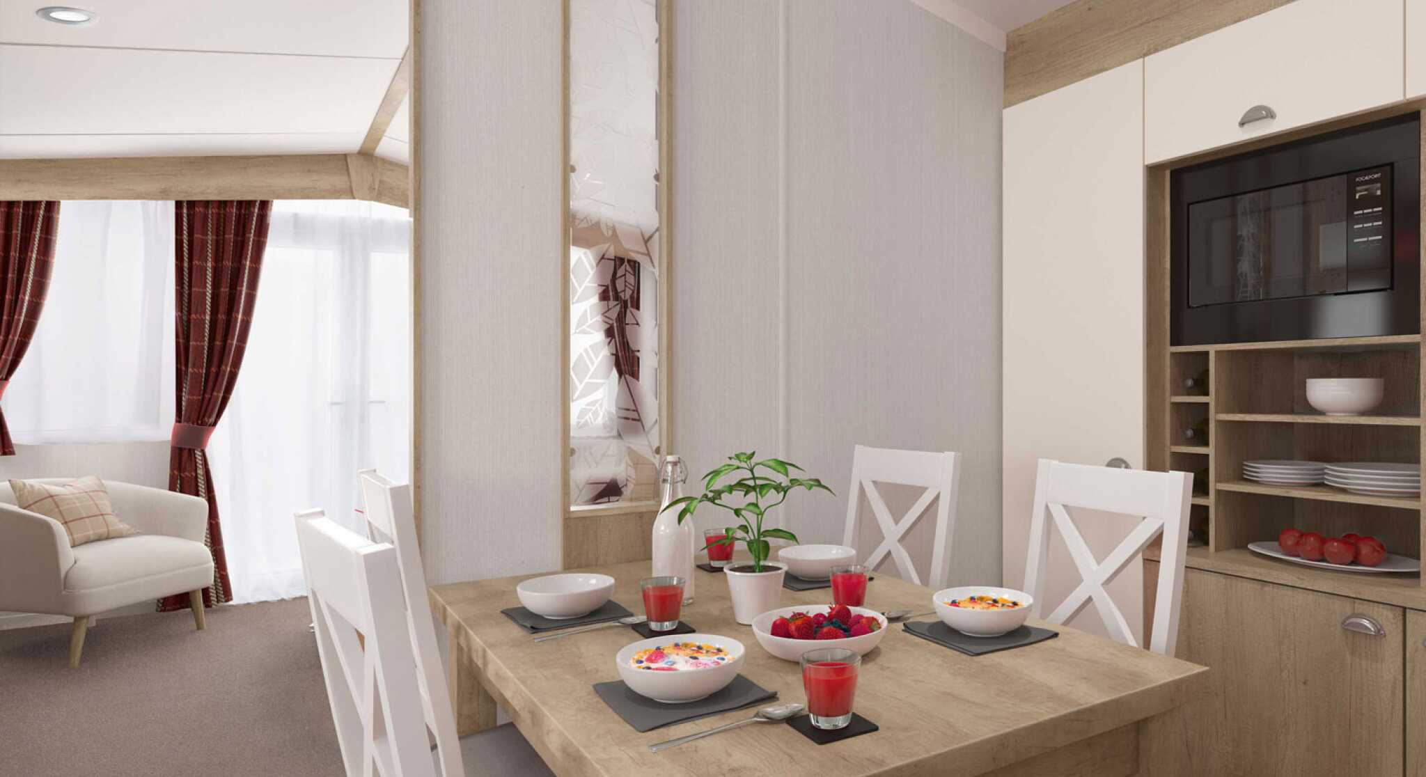 Contemporary dining area set for four with food and juice, adjacent to a comfortable living room with sofa and curtains.