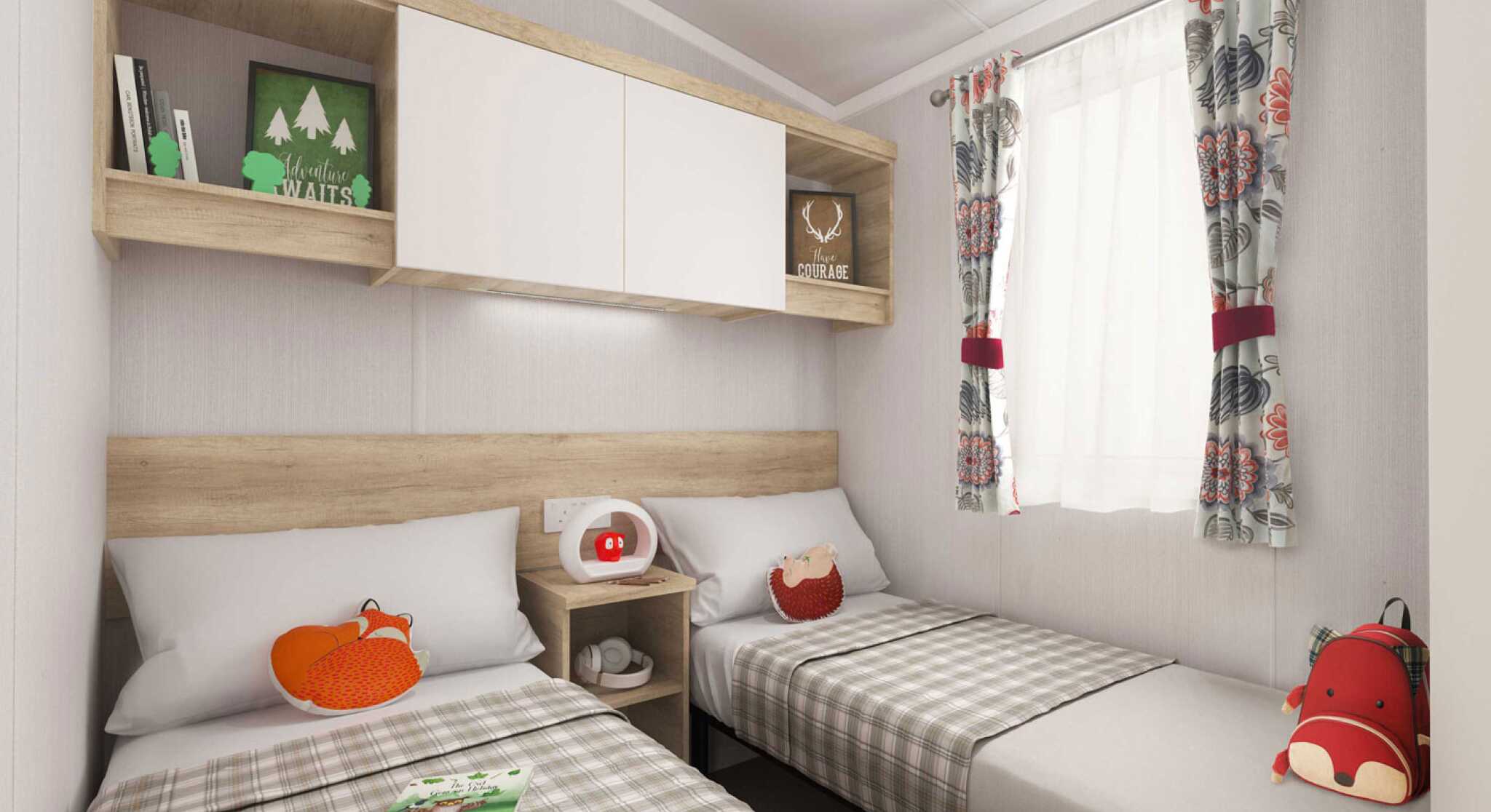 Warm twin bedroom with neutral walls, plaid-covered single beds, fox plushies, wooden shelves, and a sunny window with floral curtains.