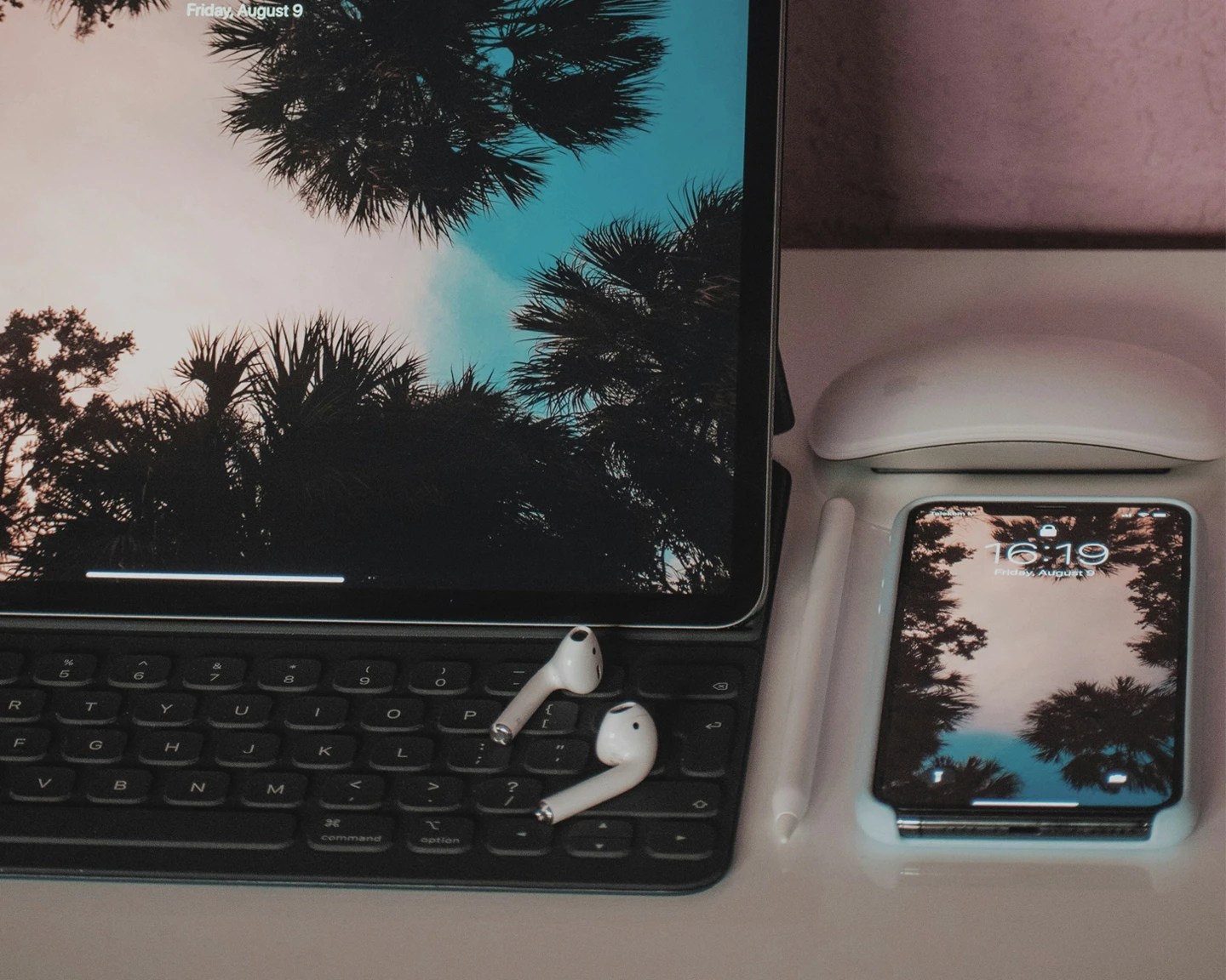 A laptop with wireless music ear buds,